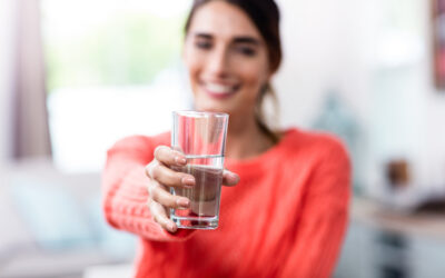 Happy,Young,Woman,Showing,Drinking,Glass,With,Water,At,Home Happy,Young,Woman,Showing,Drinking,Glass,With,Water,At,Home